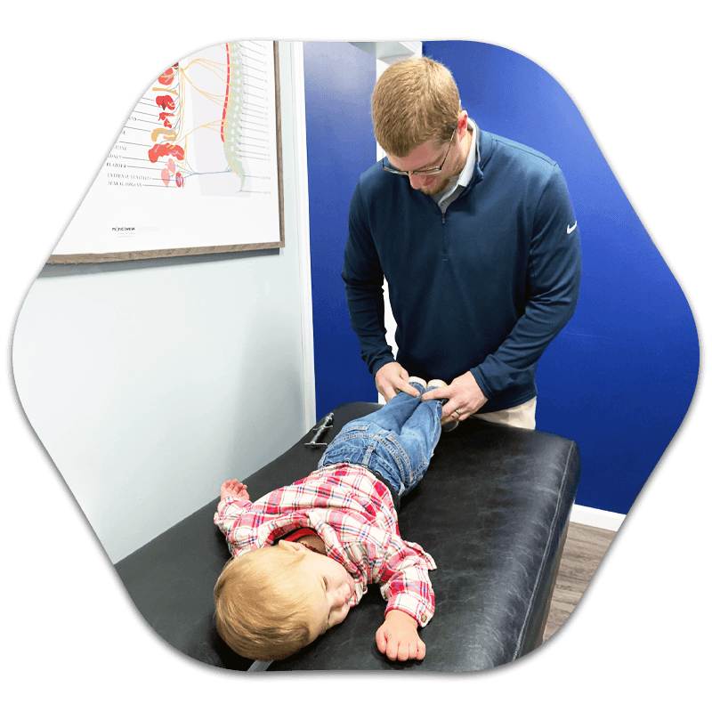 Chiropractor Britt IA Dr. Brady Wilson Adjusting Patient Chiropractor Britt IA Dr. Brady Wilson Adjusting Patient